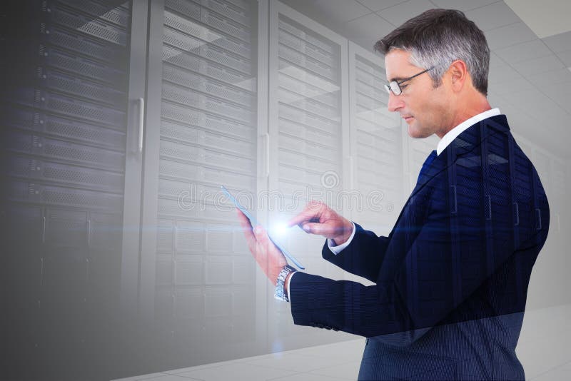 Composite image of mid section of a businessman touching tablet stock image Composite image of mid section of a businessman touching tablet stock image