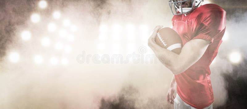Composite image of portrait of confident american football player in red jersey holding ball royalty free stock photos Composite image of portrait of confident american football player in red jersey holding ball royalty free stock photos