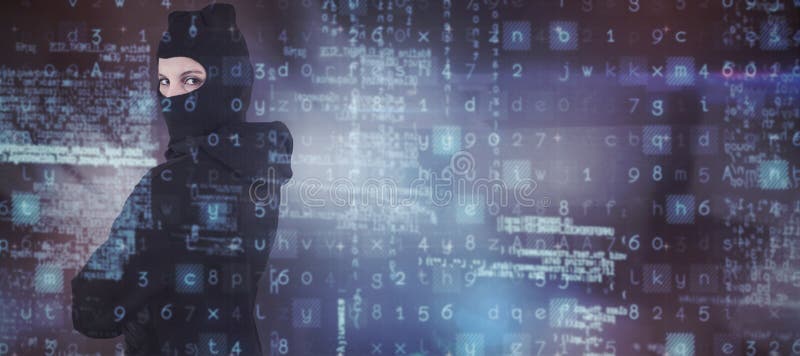 Composite image of portrait of female hacker standing wearing hoodie and balaclava royalty free stock photo