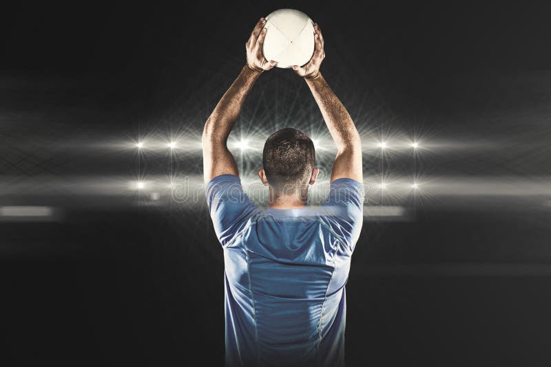 Composite Image of Rear View of Sports Player Throwing Ball Stock Photo