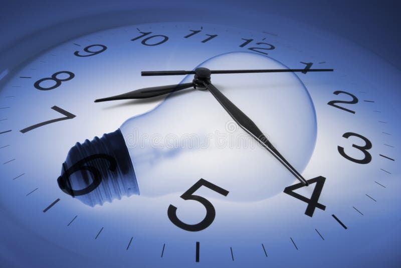 Wall Clock and Light Bulb stock image. Image of technology 128532149