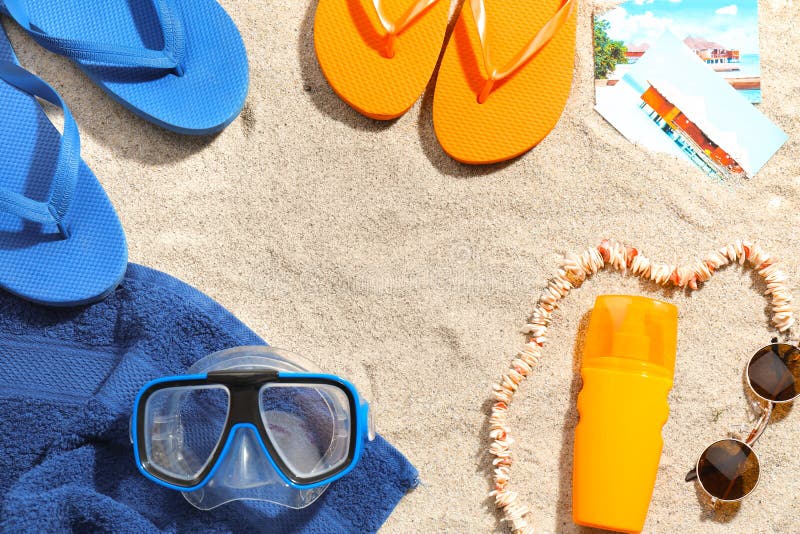 Composition with beach accessories on sand