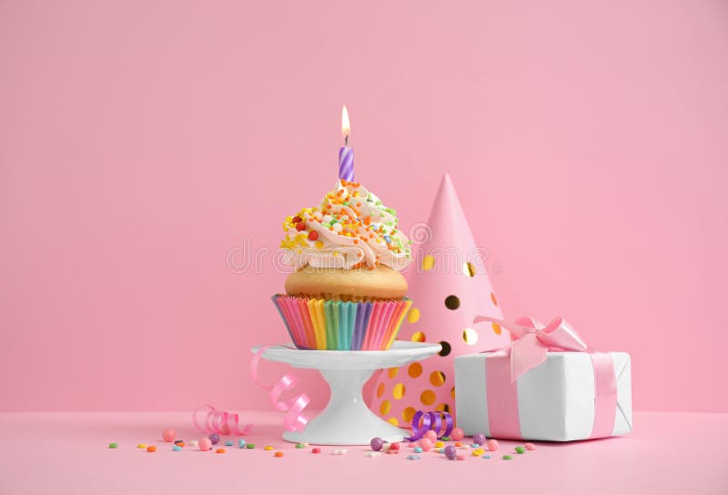Composition with Birthday Cupcake on Pink Background Stock Image ...