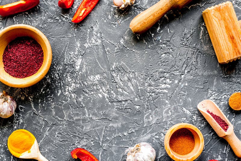 Composition of Cooking Tools and Spices on Kitchen Table Top Vie