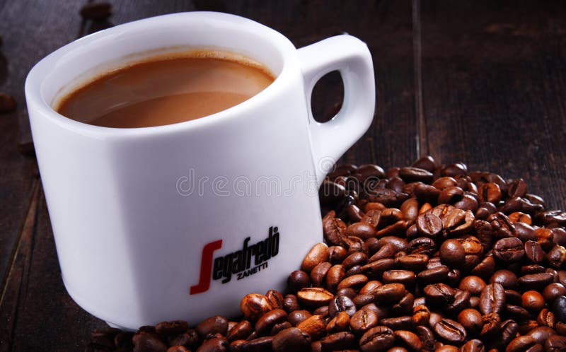 Composition with cup and beans of Segafredo Zanetti coffee