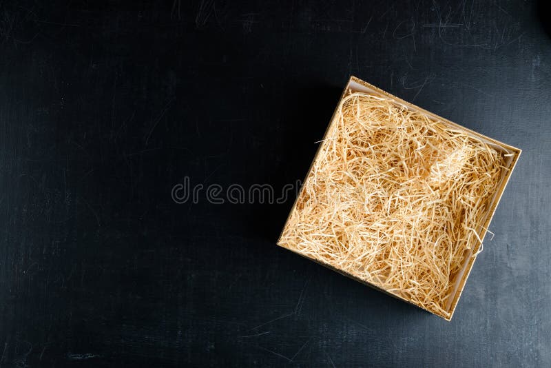 Composition with decorative straw in a box with copyspace for te stock photography