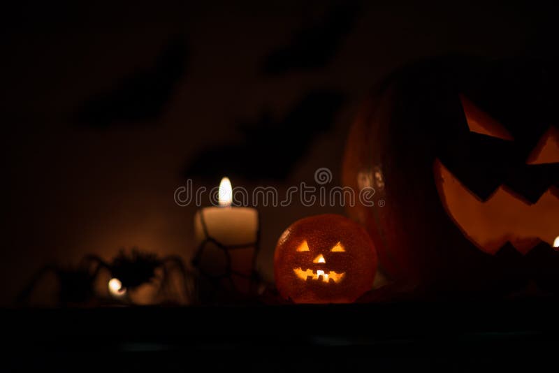 Composition for Halloween.sinister pumpkin on a dark background stock photos Composition for Halloween.sinister pumpkin on a dark background stock photos