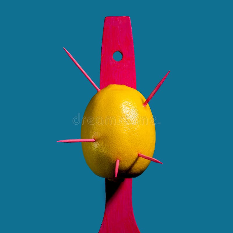 Composition with lemon and arrows on a blue background royalty free stock image