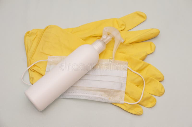 Composition of a Pair of Yellow Latex Gloves with White Plastic Bottle