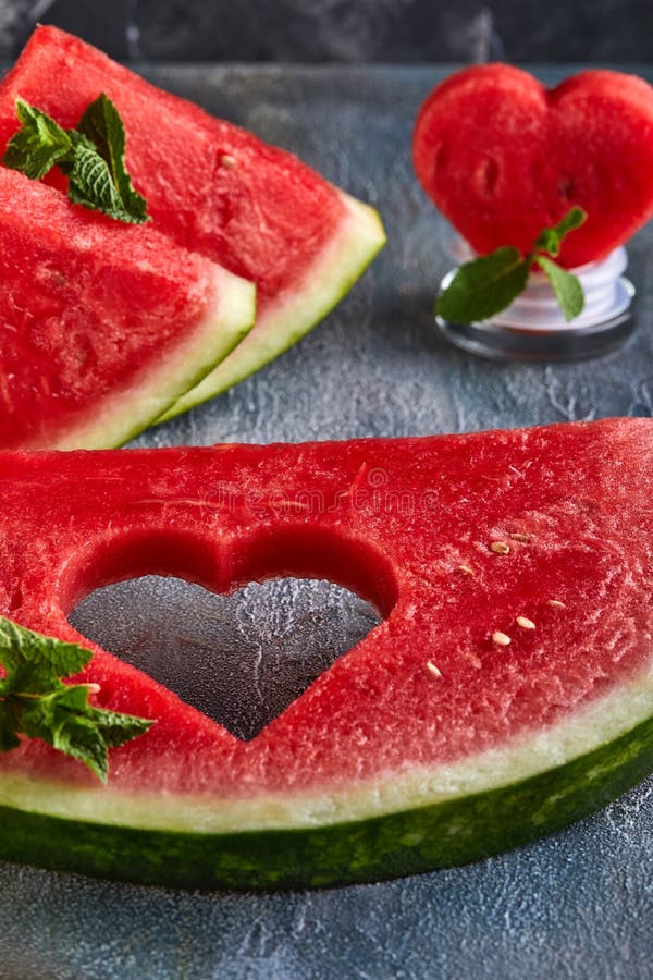 Composition with Ripe Watermelon, Mint Leaves and a Heart Carved in a ...