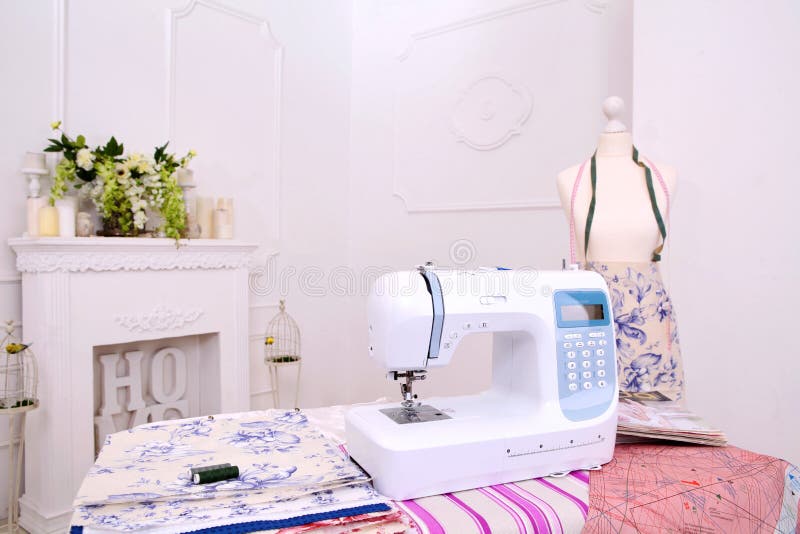Composition from a Sewing Machine. Mannequin, Flowers on a Retro Table