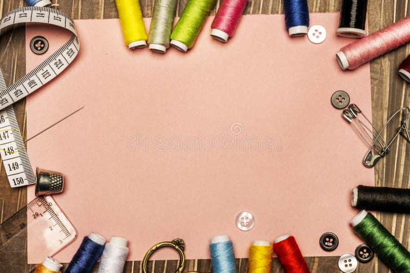 A Composition of Sewing Material with Many Spools of Colored Thread