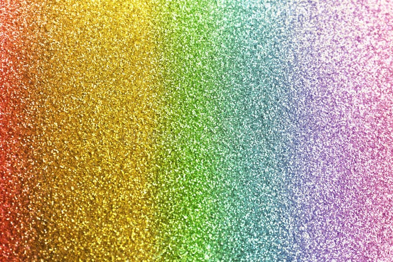 Composition of sparkling rainbow glitter as background royalty free stock i...