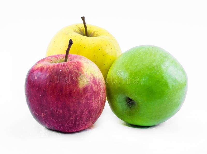 Composition of three apples on a white background - green, yellow and red - still life stock images Composition of three apples on a white background - green, yellow and red - still life stock images
