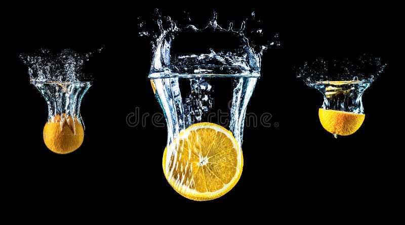 Composition of three oranges falling into water close-up, macro, splash water, bubbles, isolated, black background. stock images Composition of three oranges falling into water close-up, macro, splash water, bubbles, isolated, black background. stock images