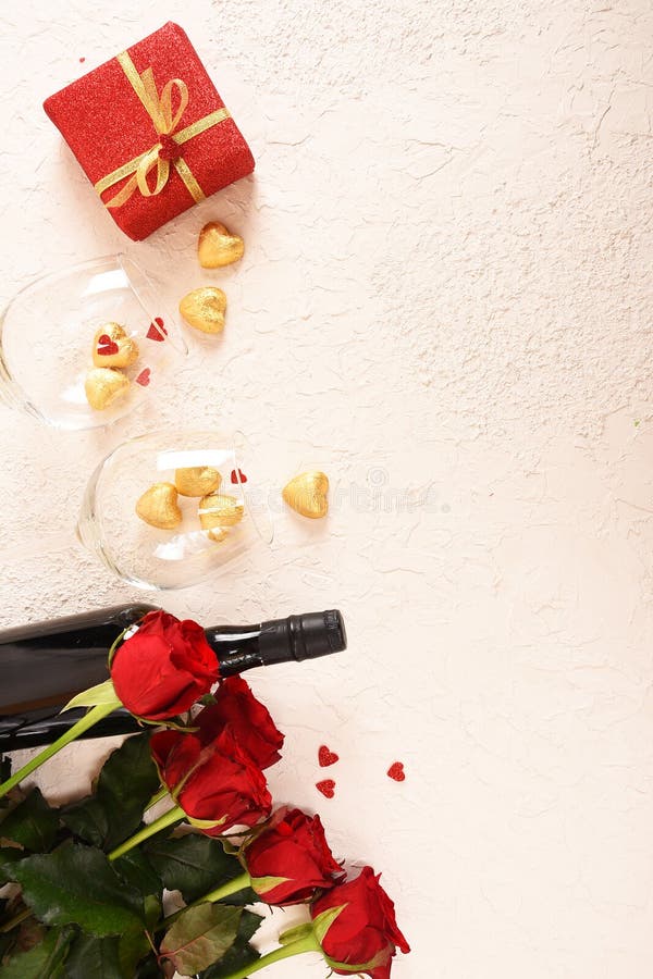 Composition for Valentine`s Day. Roses, gift, glasses and wine, red hearts. Top view. stock photography Composition for Valentine`s Day. Roses, gift, glasses and wine, red hearts. Top view. stock photography