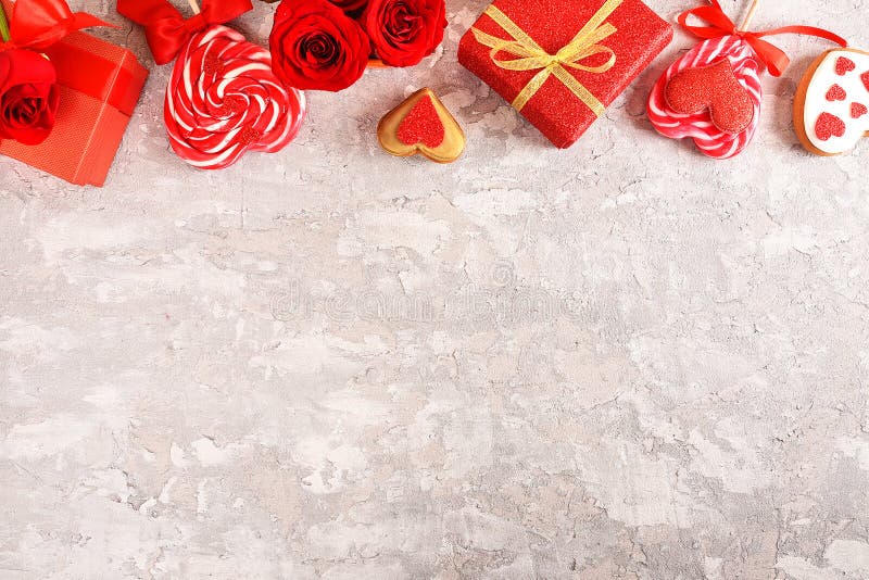 Composition for Valentine`s Day. Roses, gift, glasses and wine, red hearts. Top view. royalty free stock image Composition for Valentine`s Day. Roses, gift, glasses and wine, red hearts. Top view. royalty free stock image