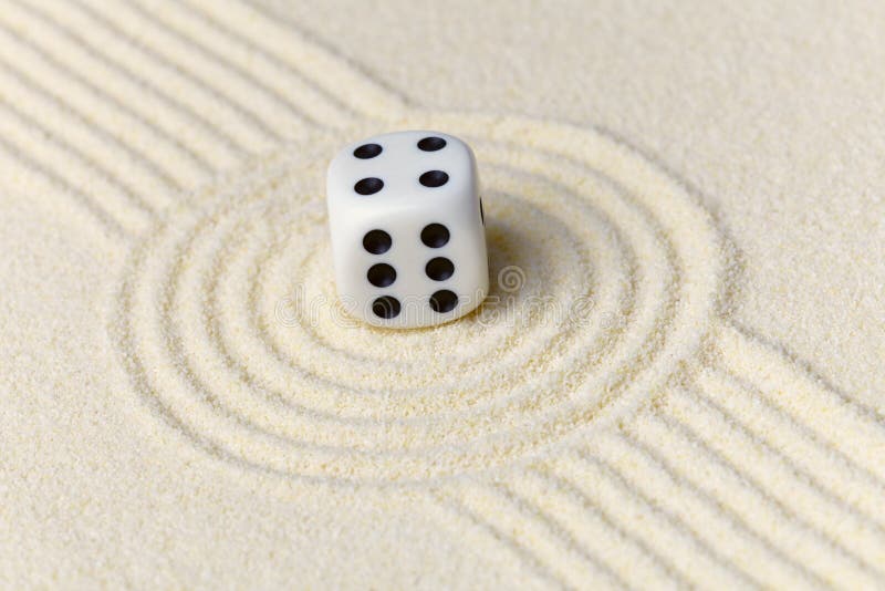 Composition on Zen garden - sand, and dice stock image Composition on Zen garden - sand, and dice stock image