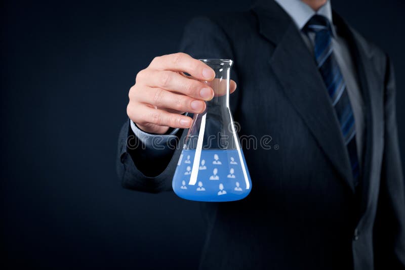 Team composition and ideal team configuration recipe is science concepts. Human resources officer is mixing ideal team in laboratory glass. Team composition and ideal team configuration recipe is science concepts. Human resources officer is mixing ideal team in laboratory glass.