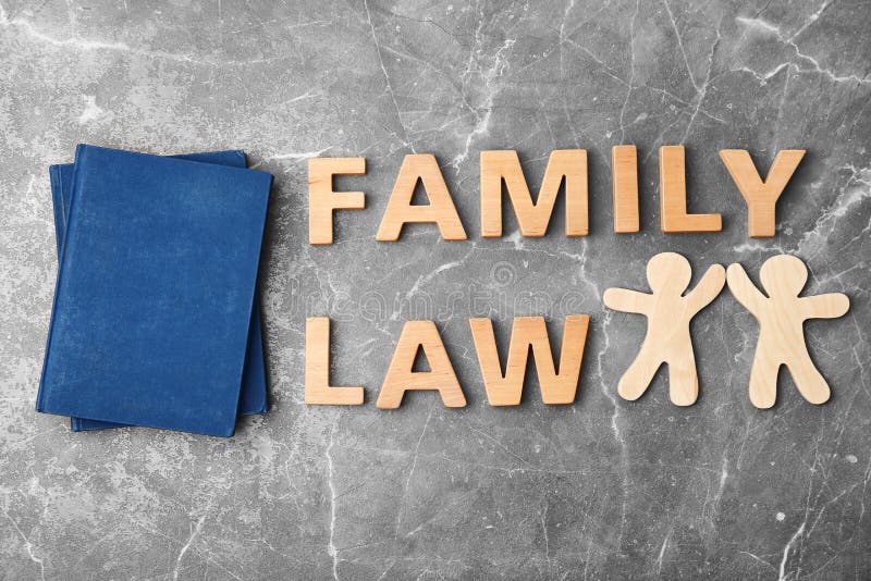 Flat lay composition with words FAMILY LAW on grey background. Flat lay composition with words FAMILY LAW on grey background