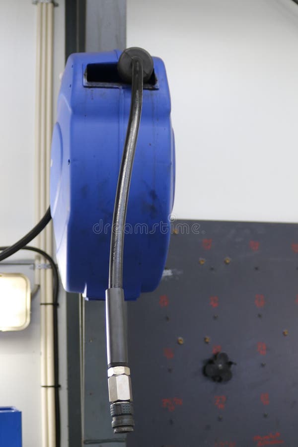 Wall Mounted Compressed Air Hose Reel Pneumatic. Stock Photo
