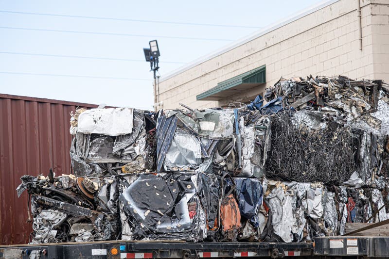 Compressed Cubes of Scrap Metal at a Junk Yard. Stock Photo Image of