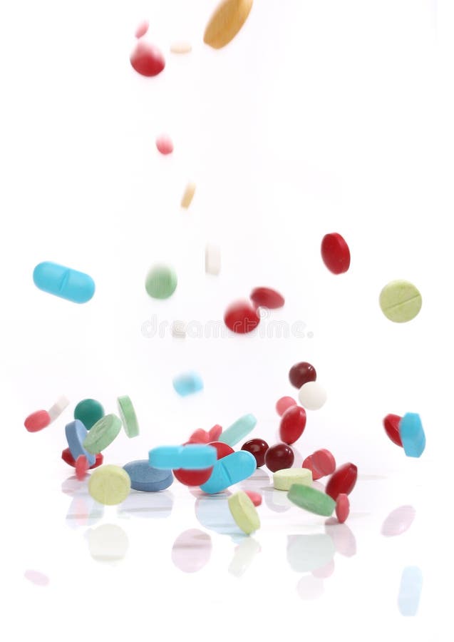 Comprimidos de queda da medicina imagens de stock Comprimidos de queda da medicina imagens de stock