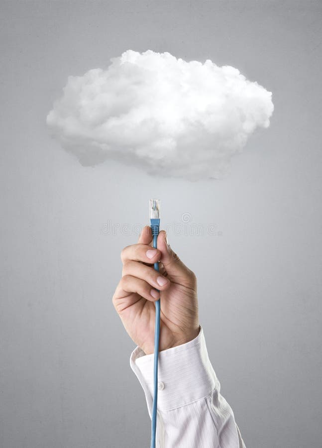 Male hand over gray background connecting cable to the cloud. Male hand over gray background connecting cable to the cloud