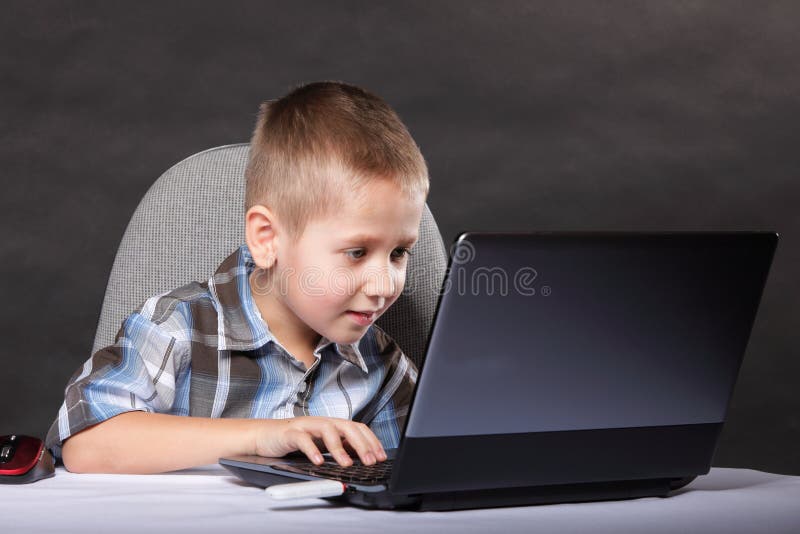Computer addiction child with laptop notebook royalty free stock photos Computer addiction child with laptop notebook royalty free stock photos