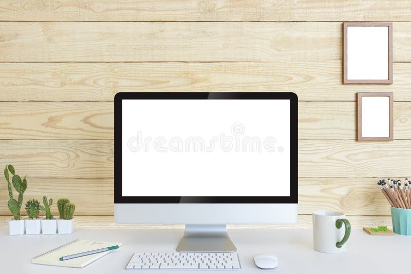Computer with blank white copy space for text and wood background.