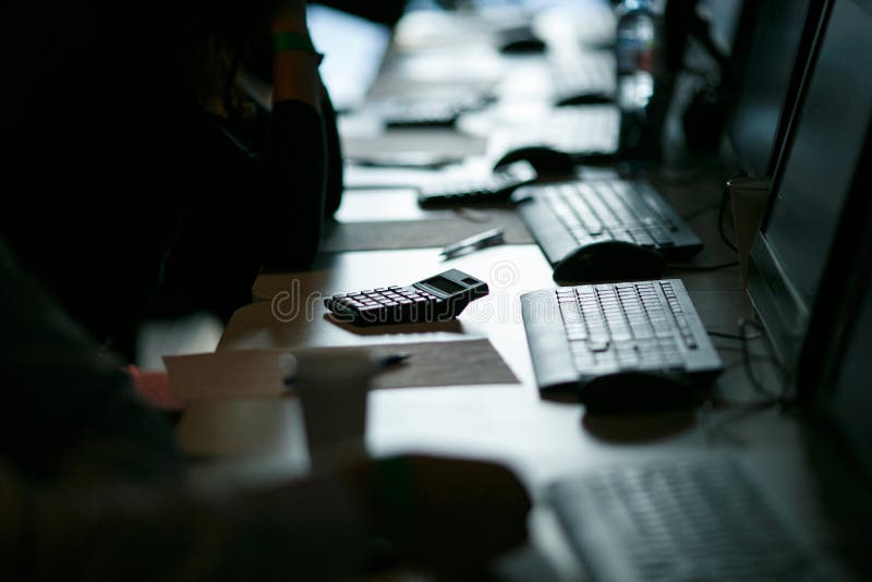 Computer class, exam, backlight in a dark manner, close-up