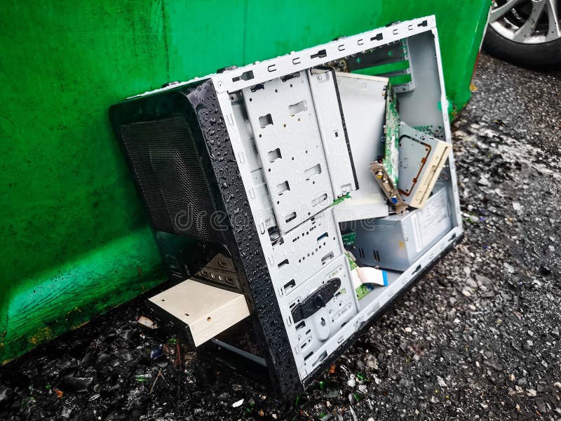 Computer Dumping Waste - Old Pc Abandoned on Wet Road Background Stock