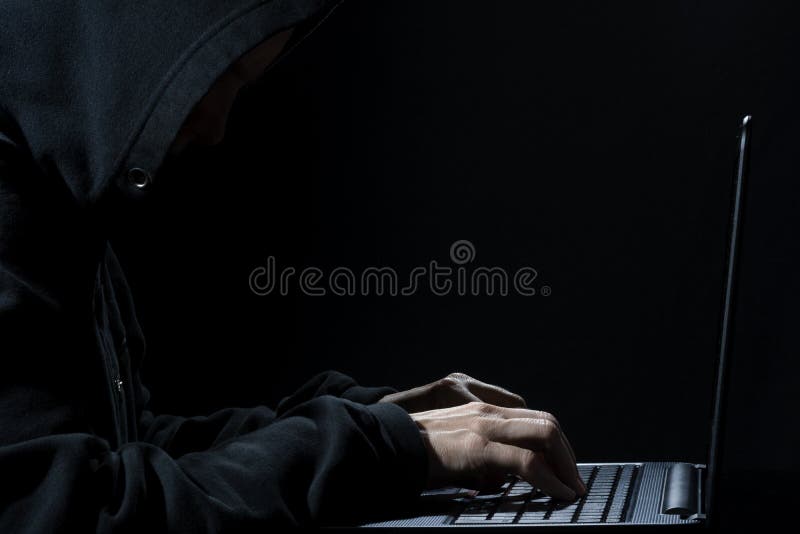 Computer Hacker in Hoodie at Work stock images