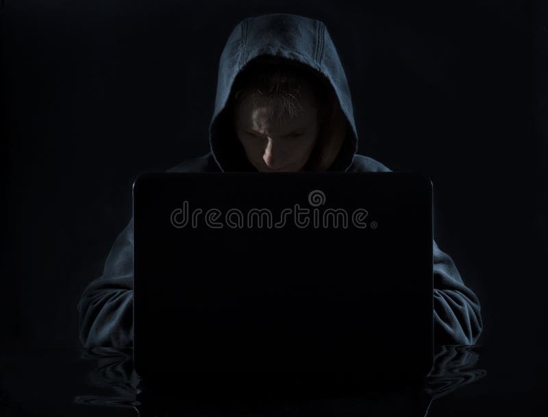 Computer Hacker in Hoodie at Work royalty free stock photo