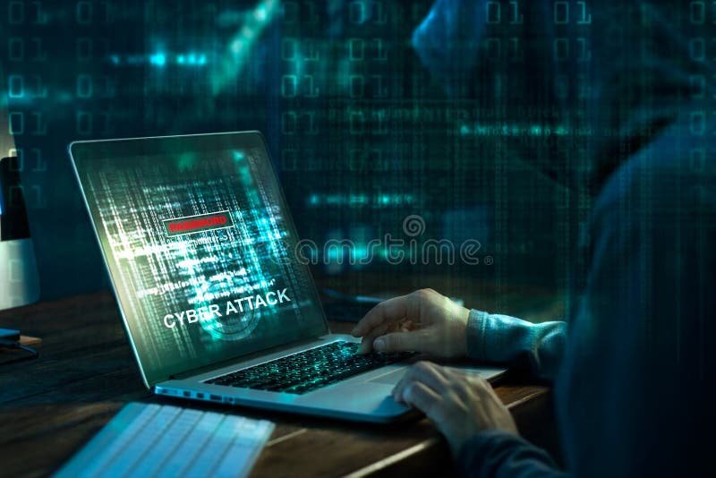 Computer hacker. Internet crime working on a code on laptop stock photo