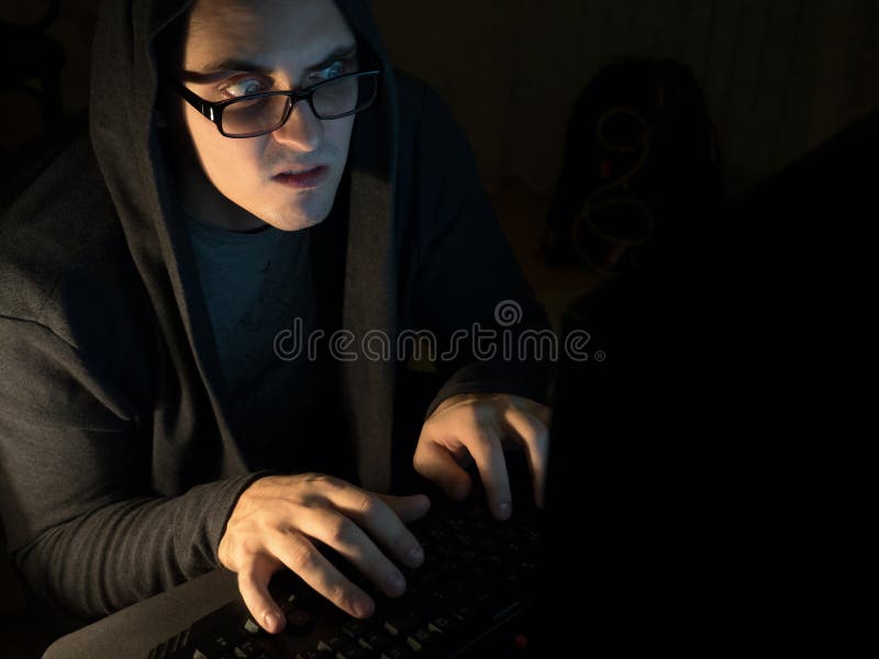 Computer hacker man stealing information with laptop.