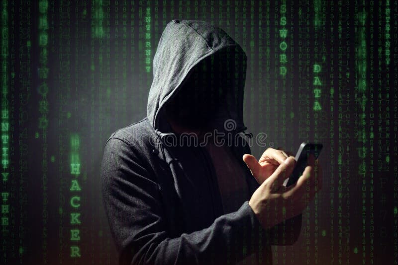 Computer hacker with mobile phone stock photo