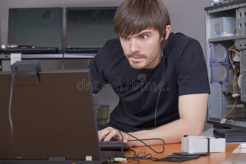 Computer hacker at work stock photos