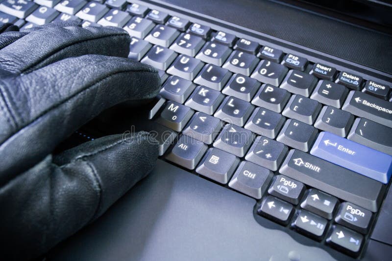 Computer hacker working on laptop royalty free stock images
