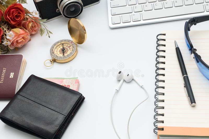 Computer keyboard with camera and notebook on white background