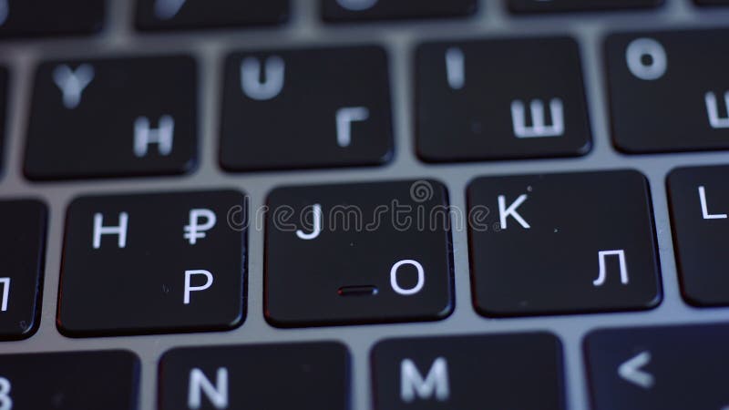 Computer keyboard details background. Close up top view of white letters on black keypad buttons of a modern laptop, concept of writing. Computer keyboard details background. Close up top view of white letters on black keypad buttons of a modern laptop, concept of writing.