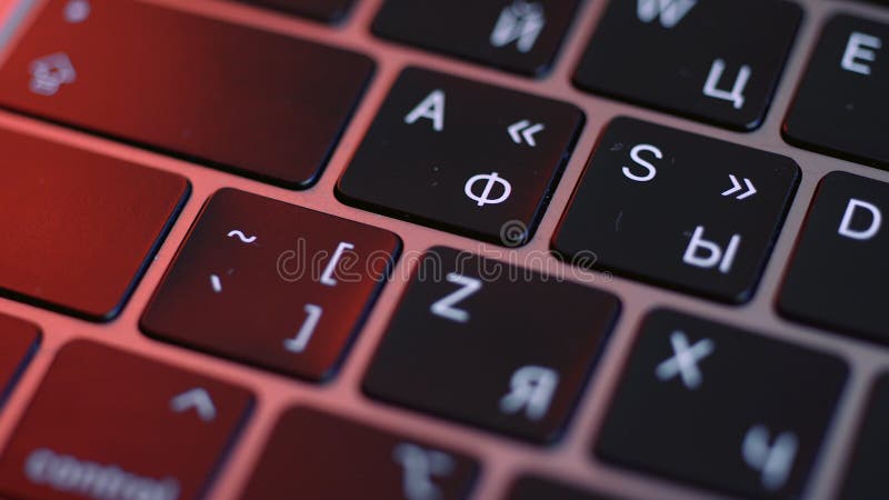 Computer keyboard details background. Close up top view of white letters on black keypad buttons of a modern laptop, concept of writing. Computer keyboard details background. Close up top view of white letters on black keypad buttons of a modern laptop, concept of writing.