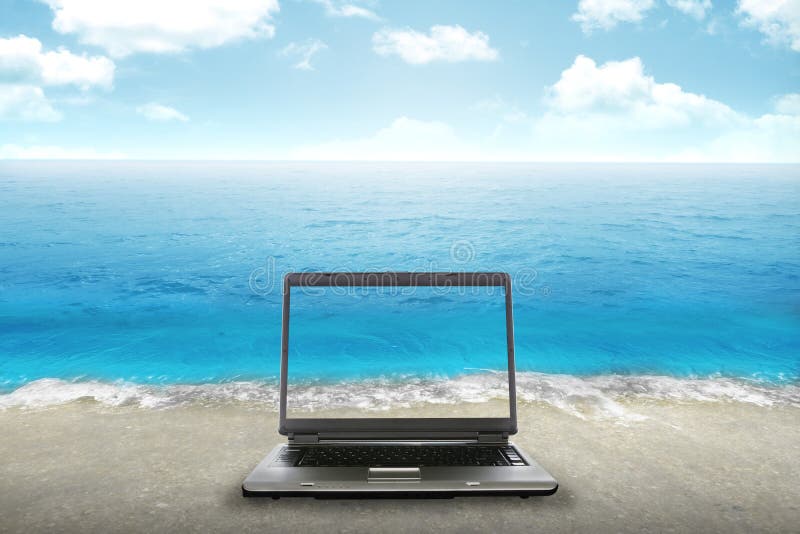 Computer laptop on the beach