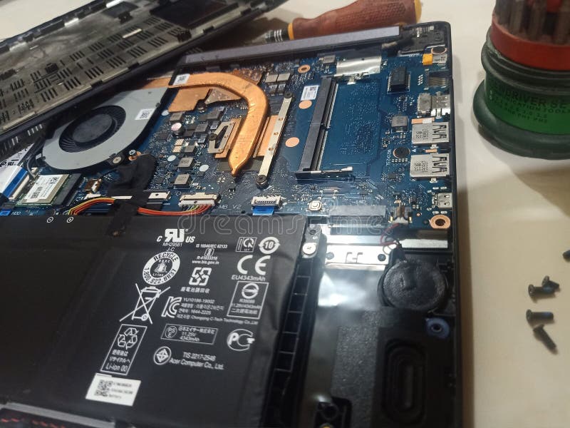 Laptop Repair, Motherboard with Processor Cooling System on Table
