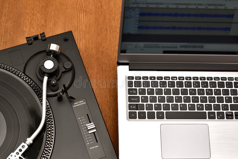 Computer laptop and turntable for digitizing vinyl records.