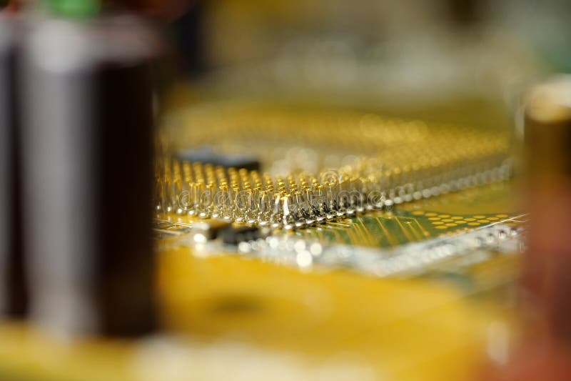 Computer microcircuit with electronic components, chips, resistors and connection terminals, close-up shot