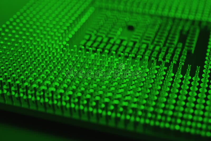 Computer processor close up. Dark green tinted background or backdrop. Information technology wallpaper. A pattern of contacts and royalty free stock photography
