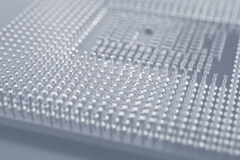 Computer processor close-up. Light gray tinted background or backdrop. Information technology wallpaper. A pattern of contacts and royalty free stock image