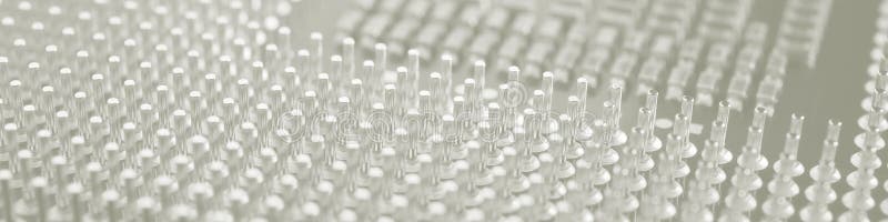 Computer processor close-up. Light gray tinted banner. Information technology headline. A pattern of contacts and semiconductors stock photography