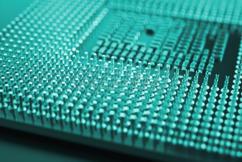 Computer processor close up. Turquoise tinted background or backdrop. Information technology wallpaper. A pattern of contacts and stock image